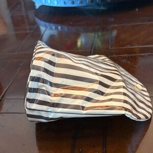 Henry Bendel, famous brown and white stripe travel pouch